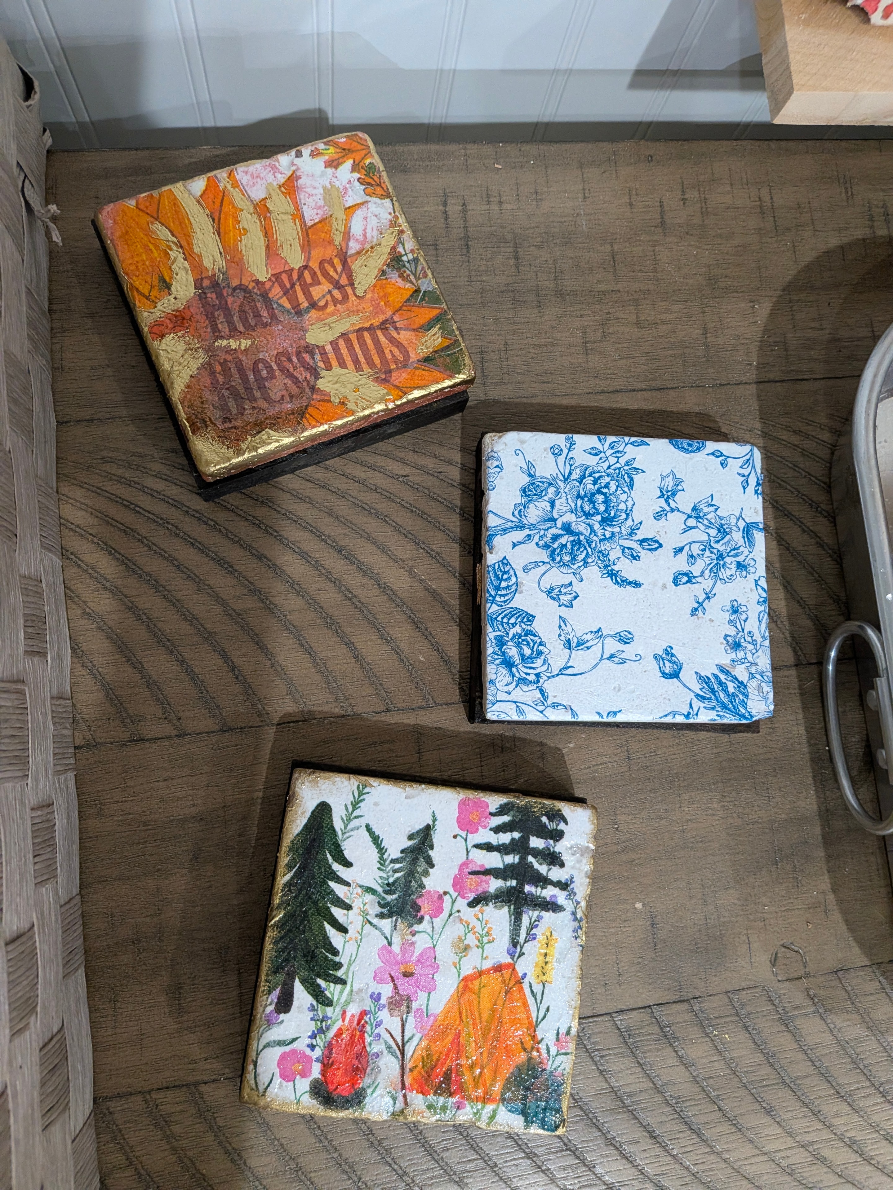 Three decorated wooden boxes with mixed media floral and botanical artwork